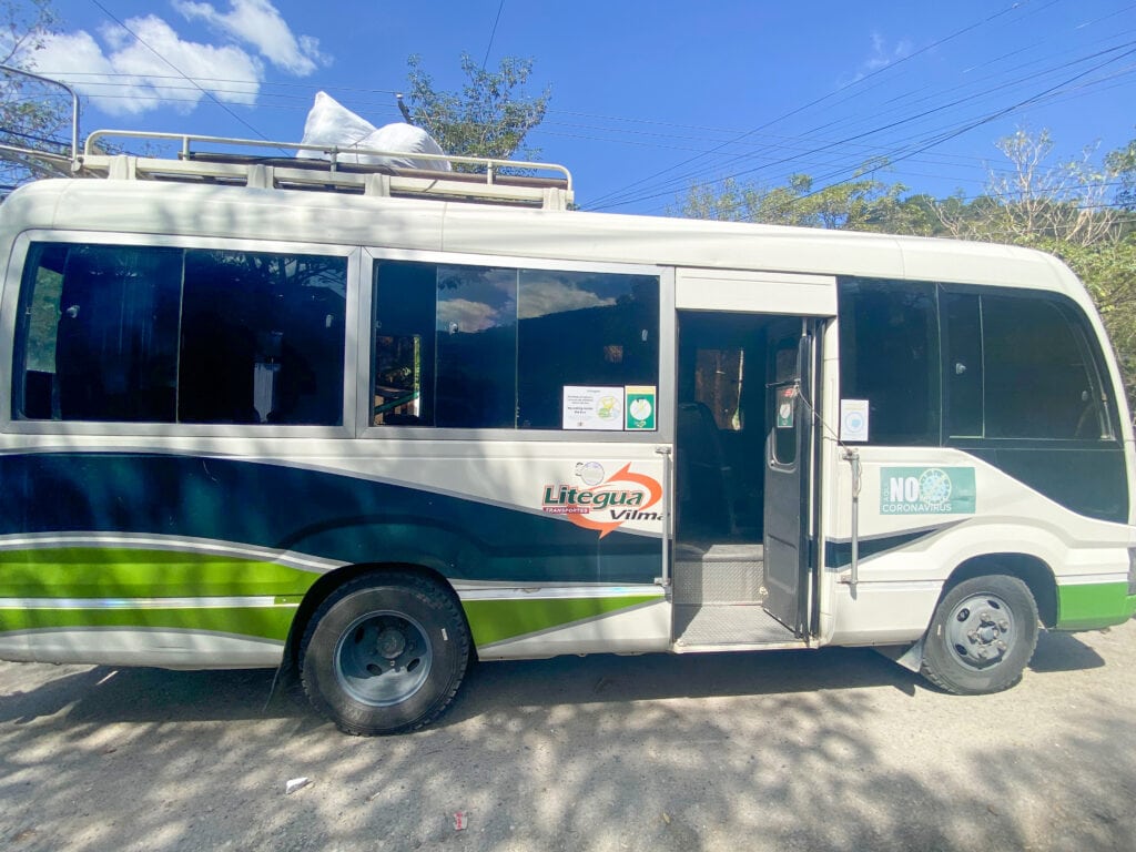 A white and green mini bus.