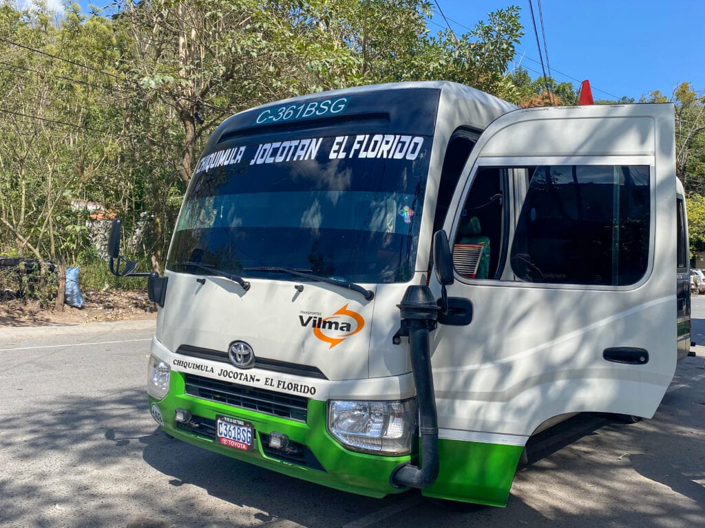 A white and green bus that says Chiquimula - Jocotan - El Florido on the windshield.