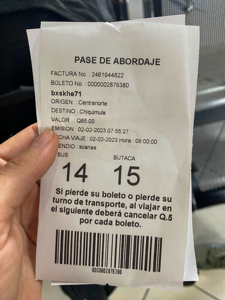 A Guatemalan bus ticket for seats 14 and 15.
