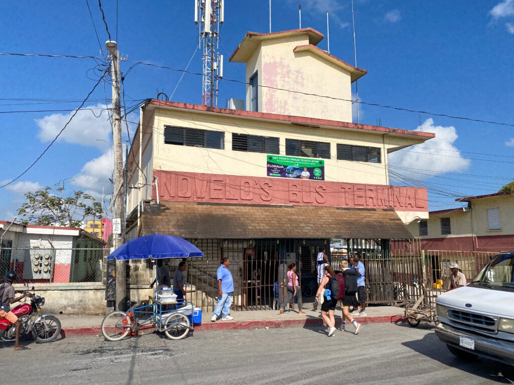 A yellow and red building that says Novelo's bus terminal.