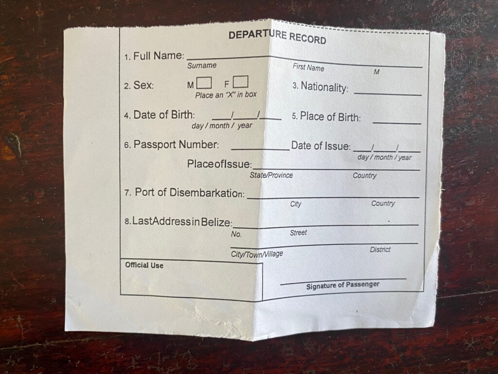 A white paper that says "departure record" at the top and has places to fill out demographic information.