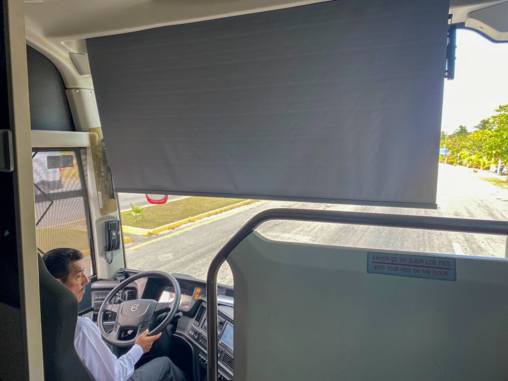 A big window looking out the front of a ADO bus in Mexico.