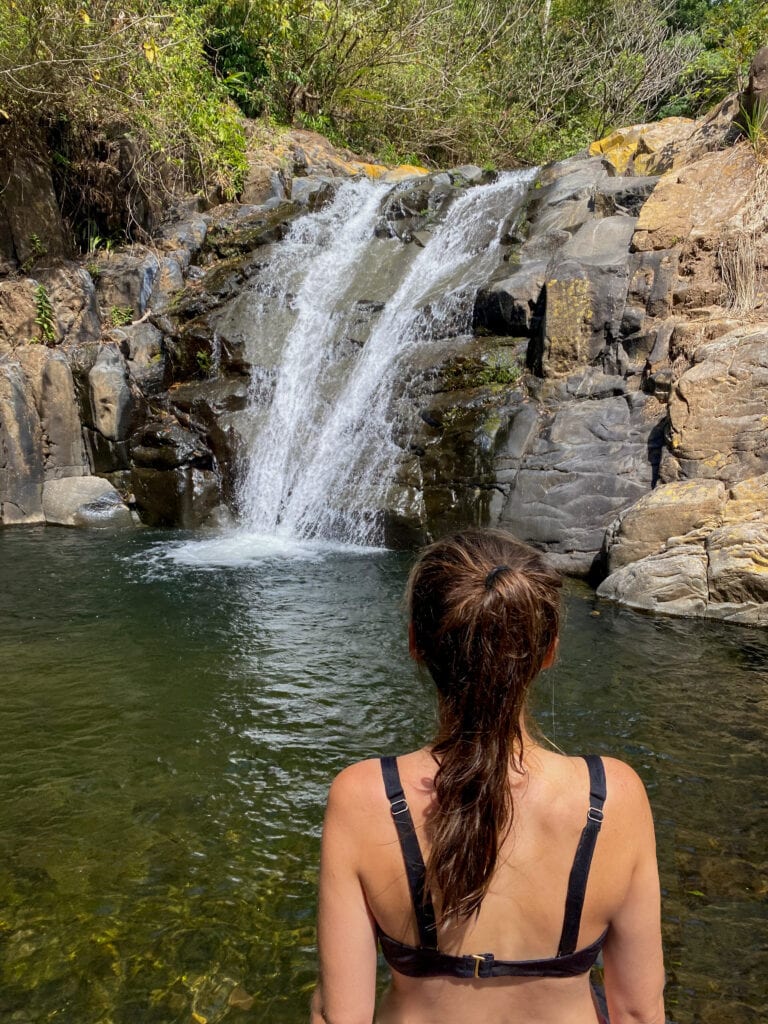 Sarah looks out at a waterfall in El Salvador.