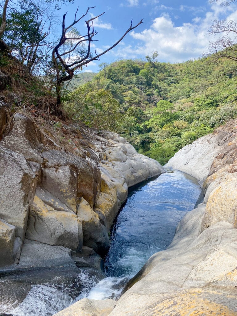 A river in El Salvador in El Impossible National Park along the cliff jumping tour.
