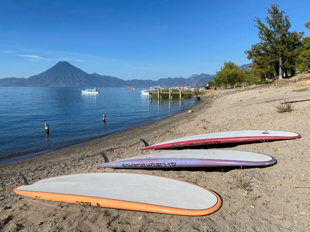 Salpores beach with 3 paddle boards on the sand.