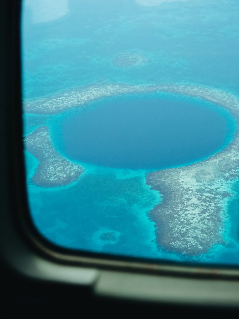 The Great Blue Hole in Belize, viewed from plane window.