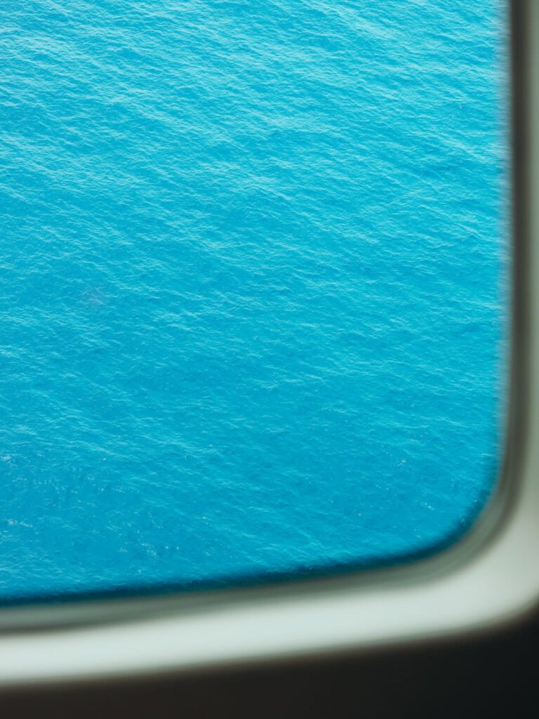 View out the window from a scenic flight of the Blue Hole in Belize