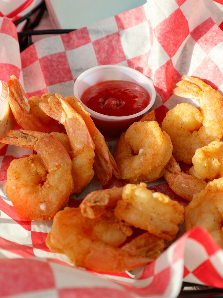 A basket of gluten free fried shrimp.