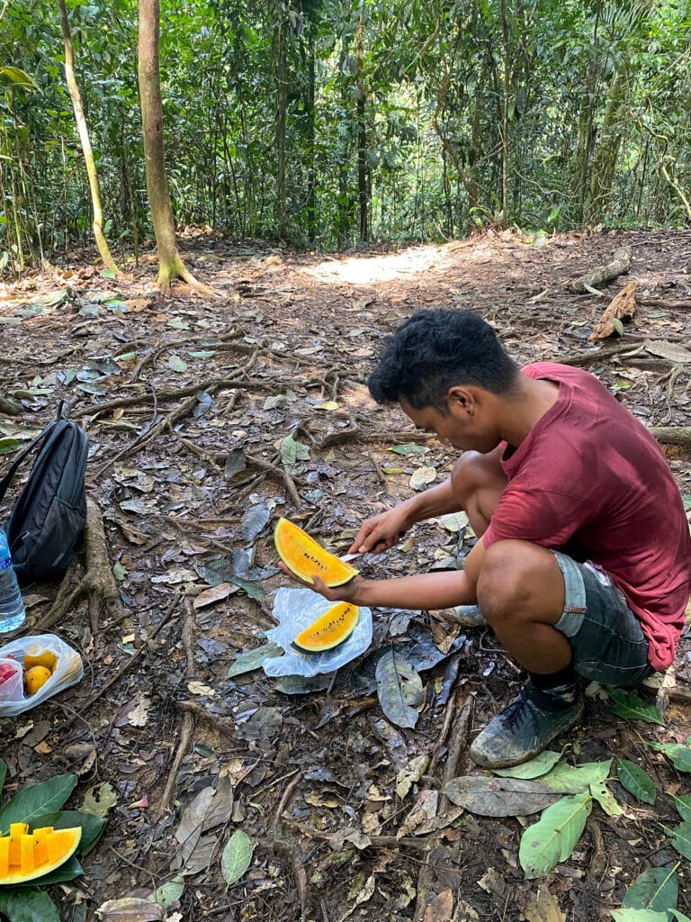 Bagas cuts a watermelon