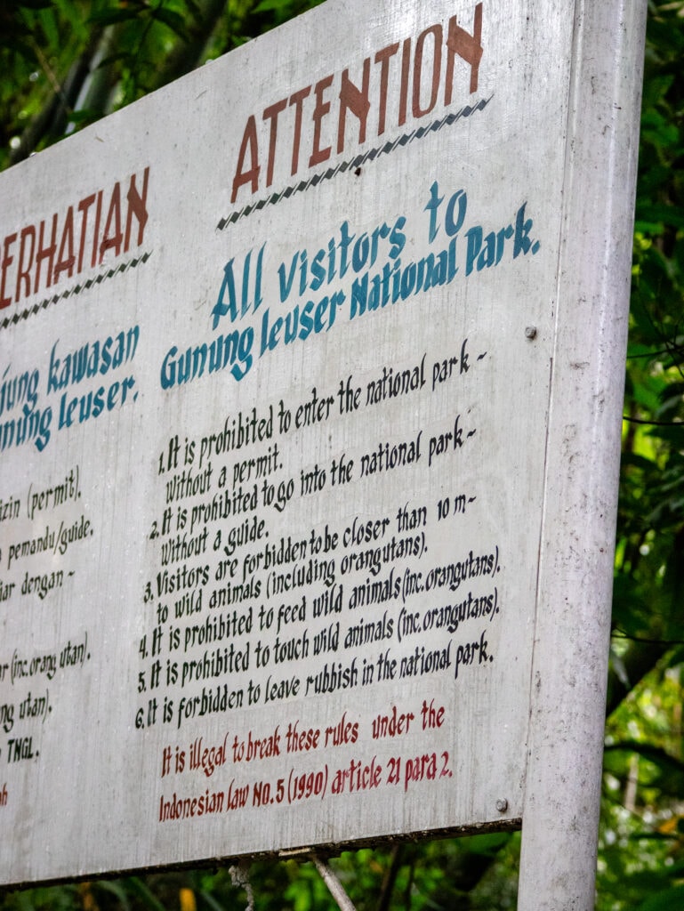Sign post with rules for entering Gunung Leuser National Park