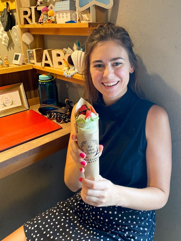 Sarah smiles with her gluten free crepe.