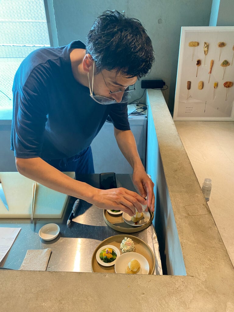 Tokyo chef prepares meal.