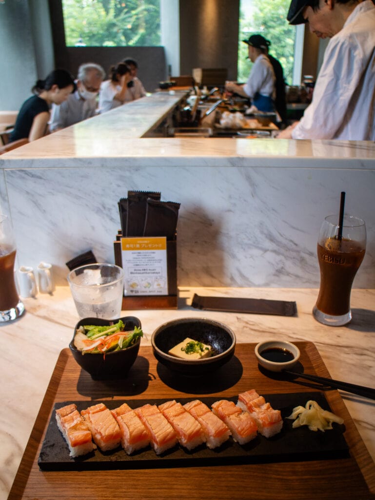 Sitting at sushi bar Tokyo.