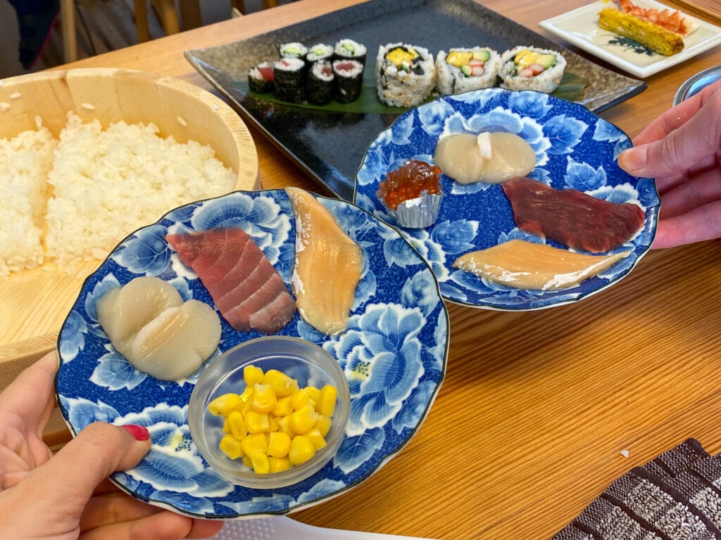 Two plates of sashimi ingredients.