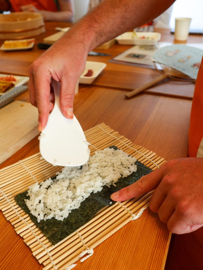 Sushi making class Tokyo - rolling sushi.