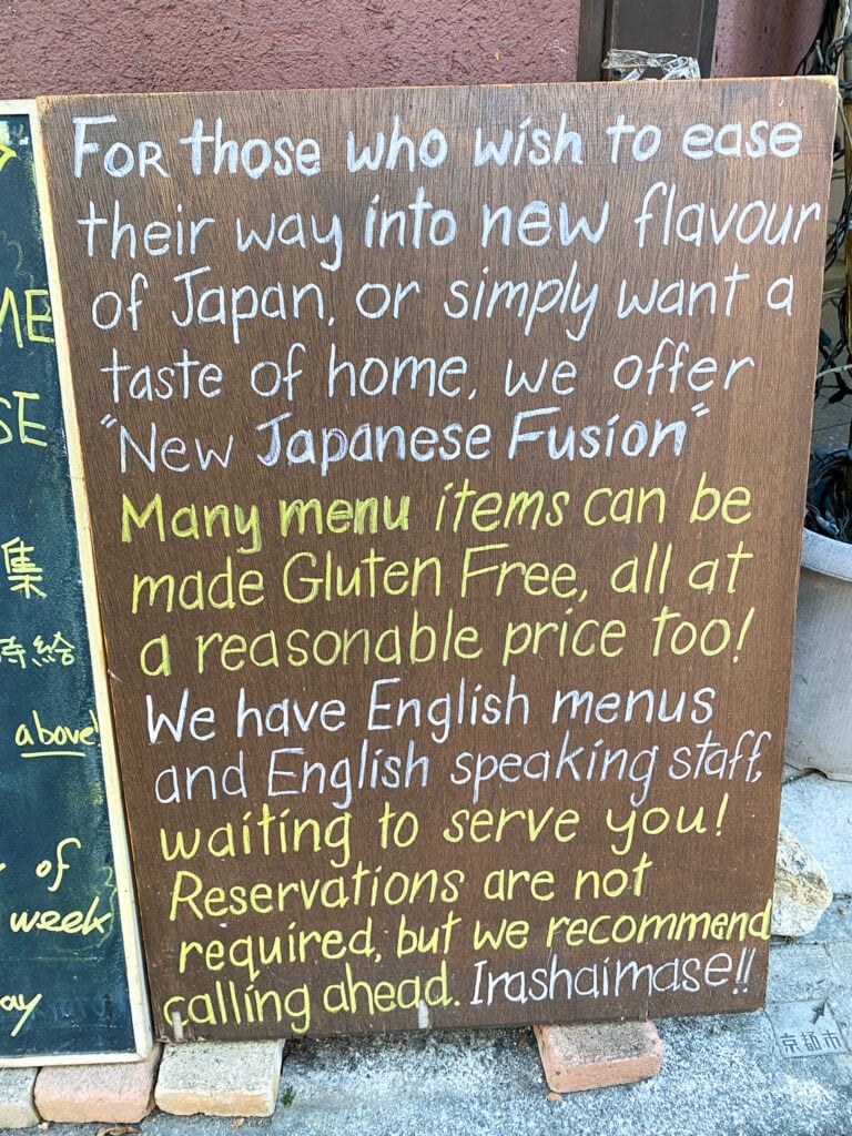 Sign outside sugarhill Kyoto that says "many menu items can be made gluten free, al at a reasonable price too!"