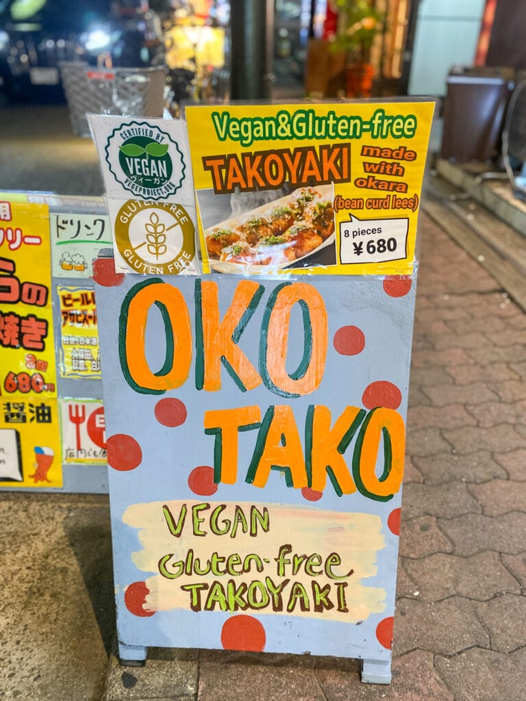 Sign that says "OKO TAKO vegan gluten free takoyaki"