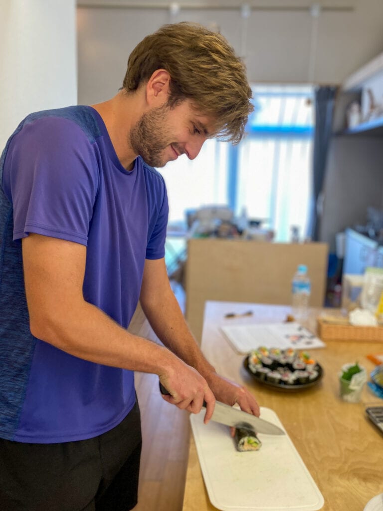 Dan cutting sushi