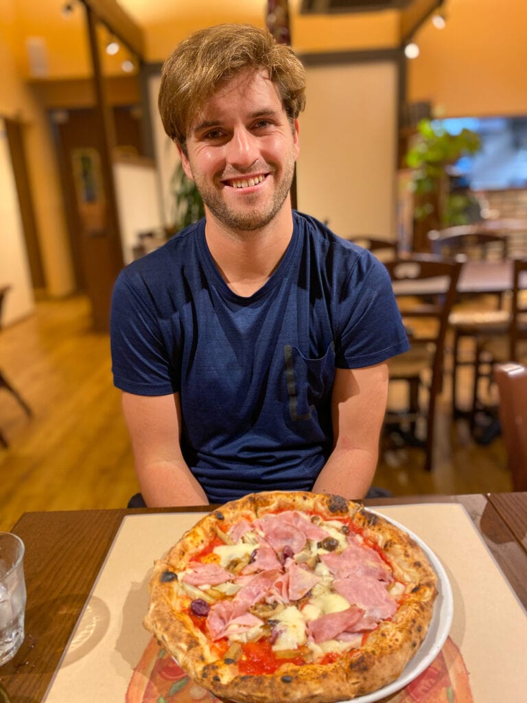 Dan with pizza in Nara Japan