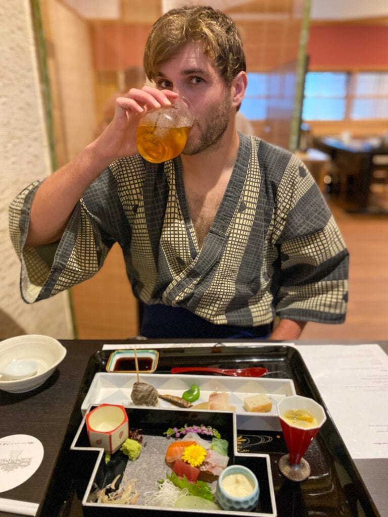Dan drinks tea at ryokan dinner