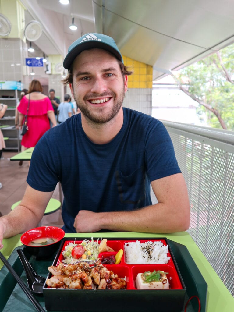 Dan with meal at hawker center in singapore