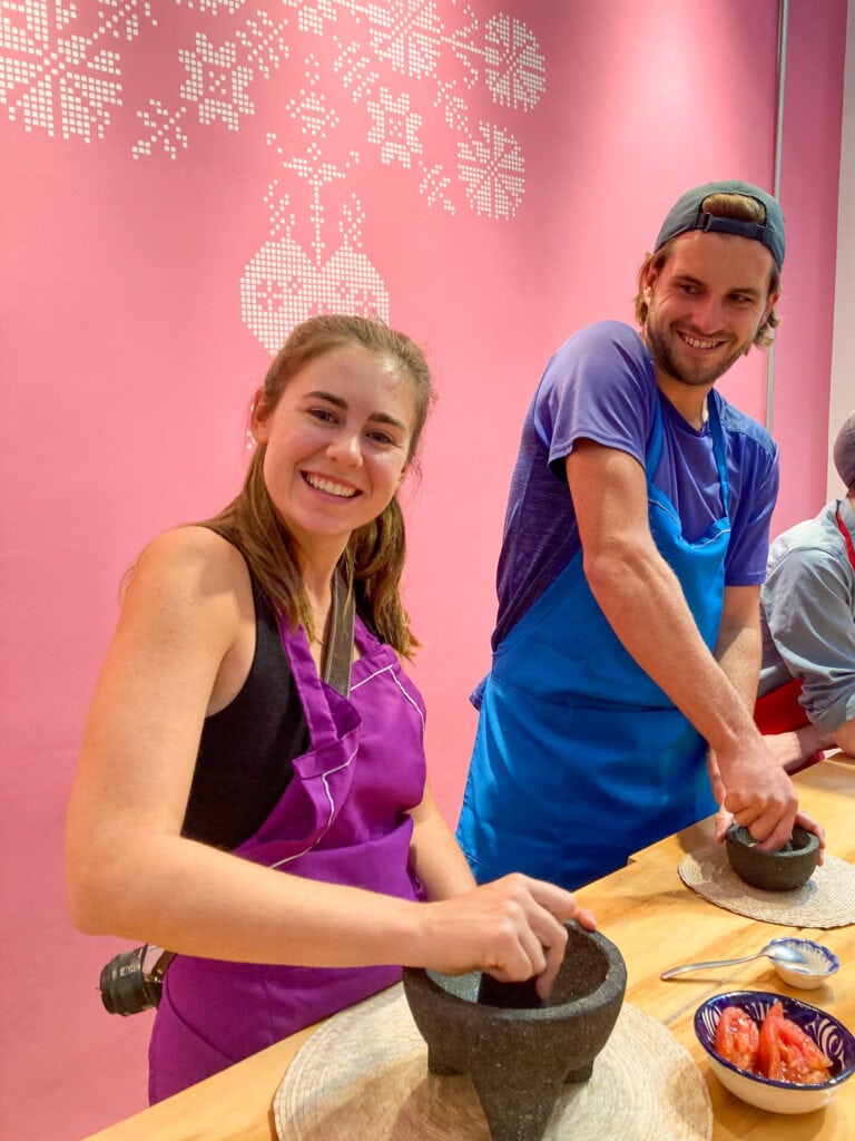 Sarah and Dan making salsa at Aura Cocina cooking class in Mexico City