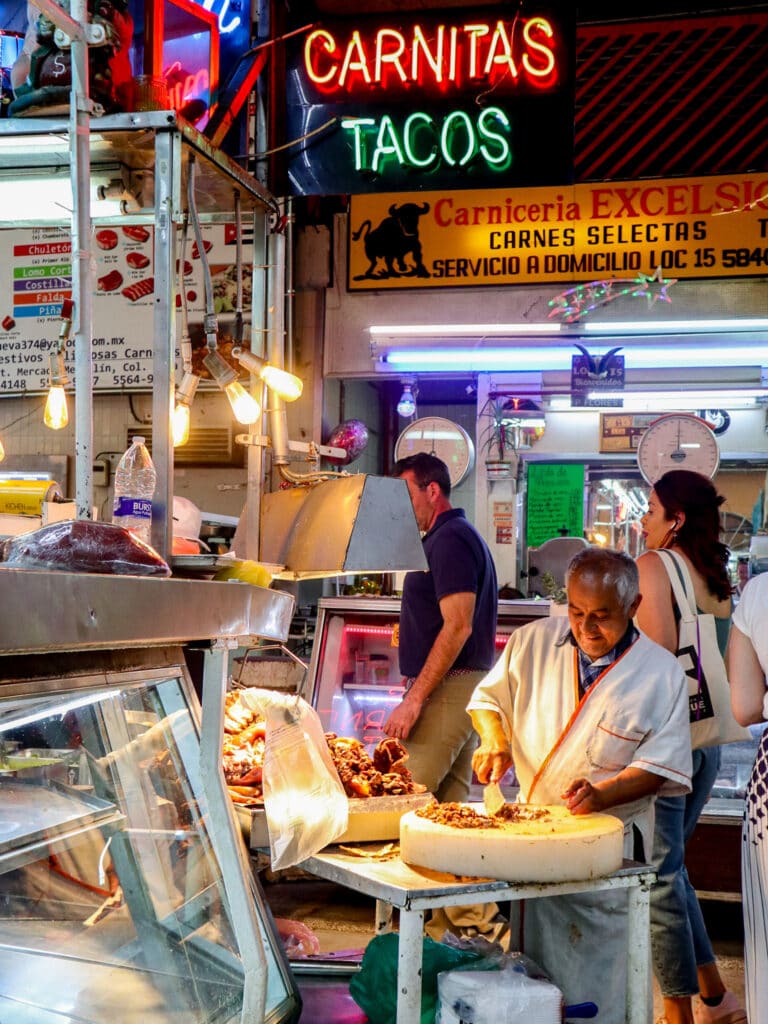 meat vendor at mercado medellin.