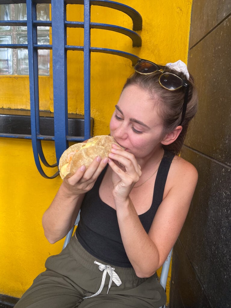 Sarah eating taco on taco tour in Mexico City