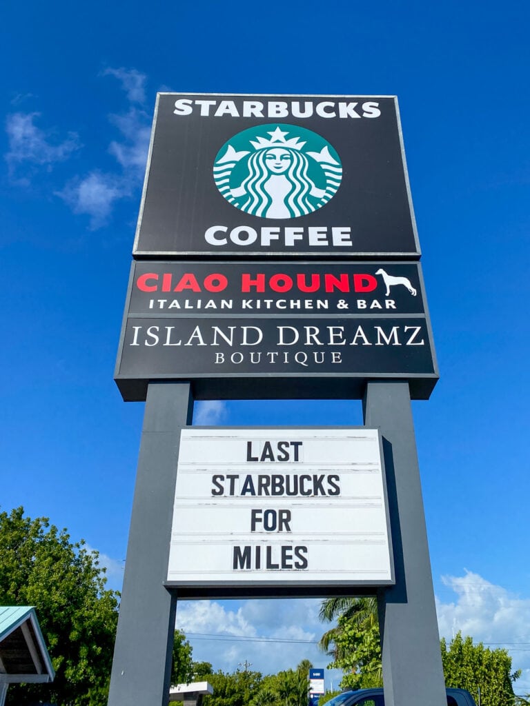 sign that says last starbucks for miles