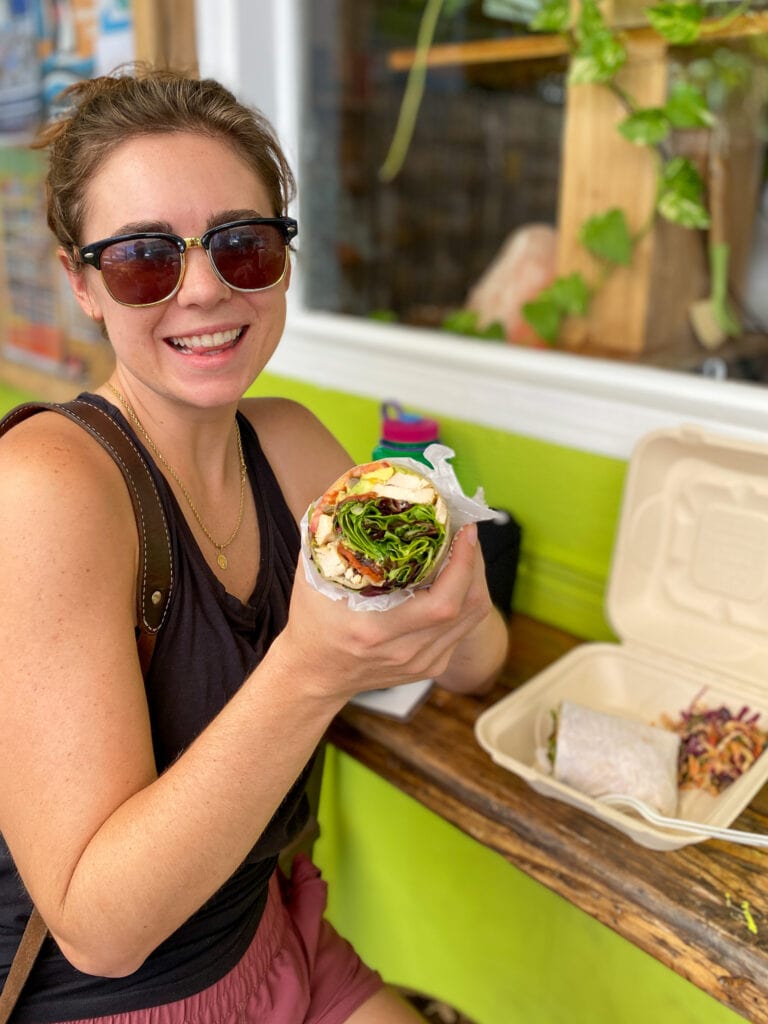 Sarah eating a wrap at Date & Thyme in key west