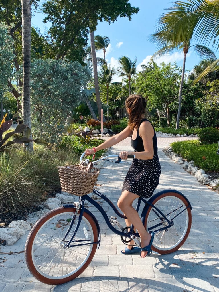 Sarah on bike at postcard inn