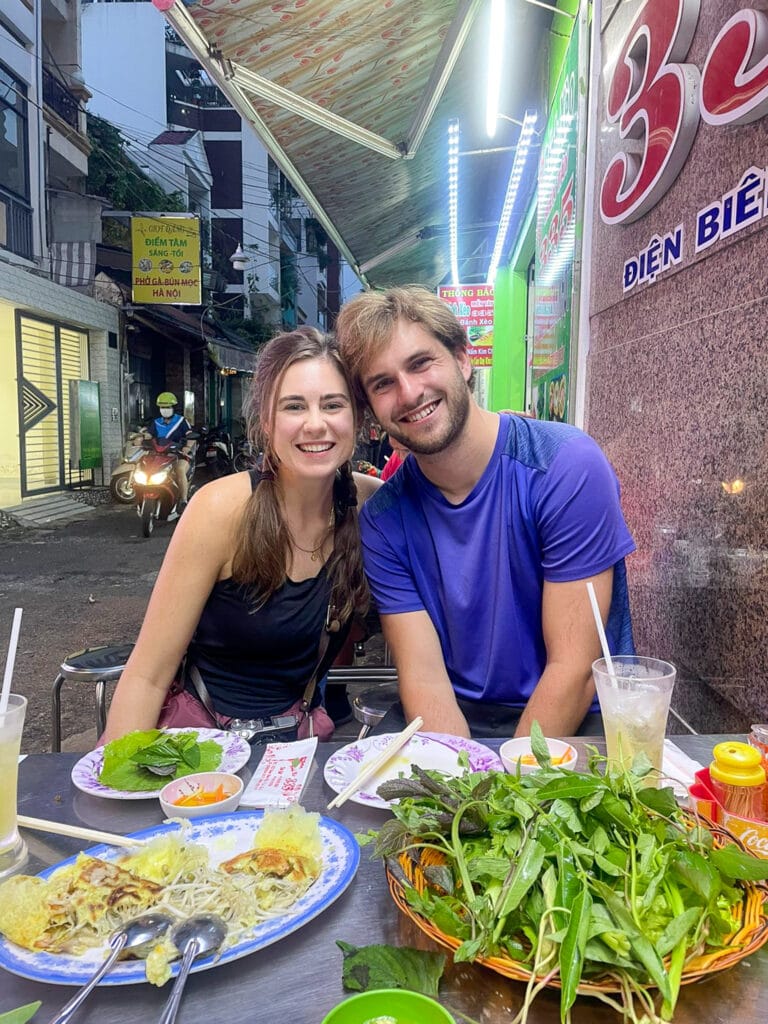 Sarah and Dan on street food man gluten free street food tour of Vietnam