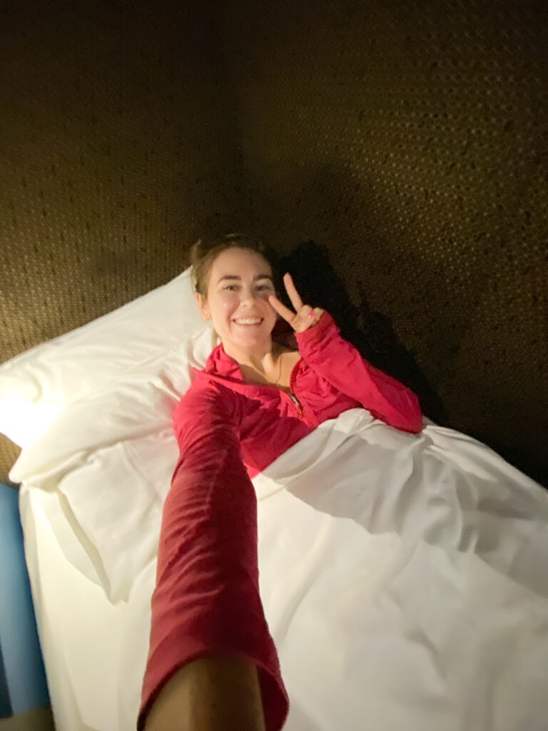 Sarah in sleeping pod at KL airport