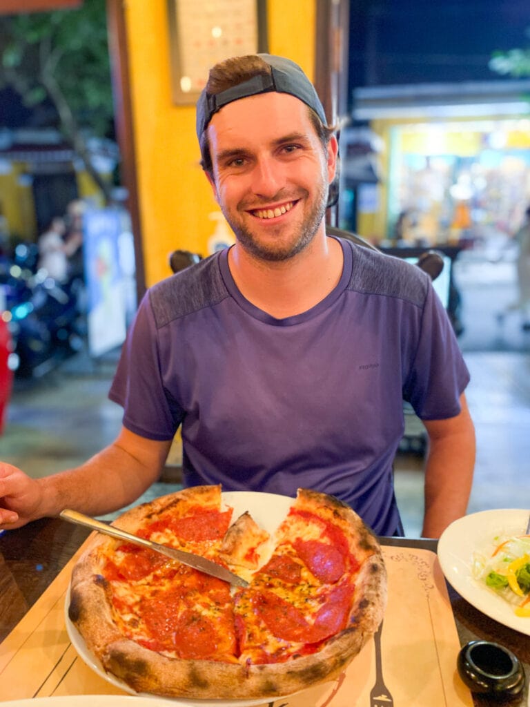 Dan with pizza at Goodmorning Vietnam in Hoi An