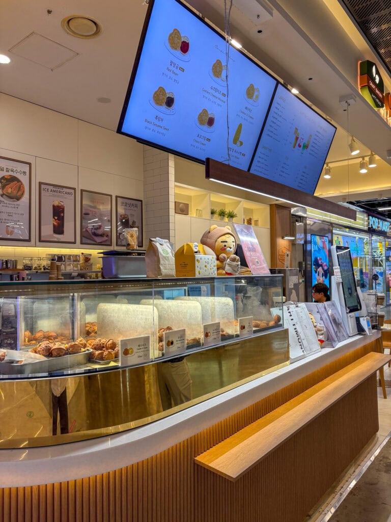 Counter of Attimong with menu and display case.