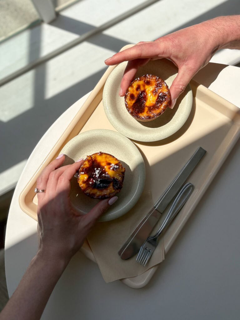 Two hands reaching for egg scones