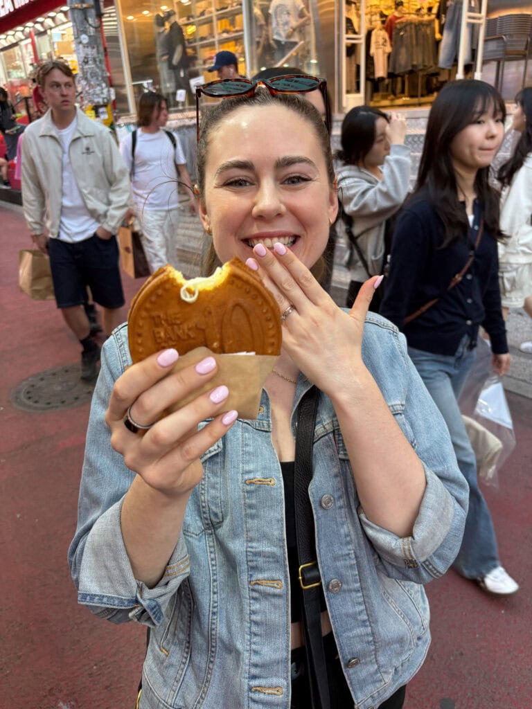 Sarah holding a gluten free coin cake in Seoul