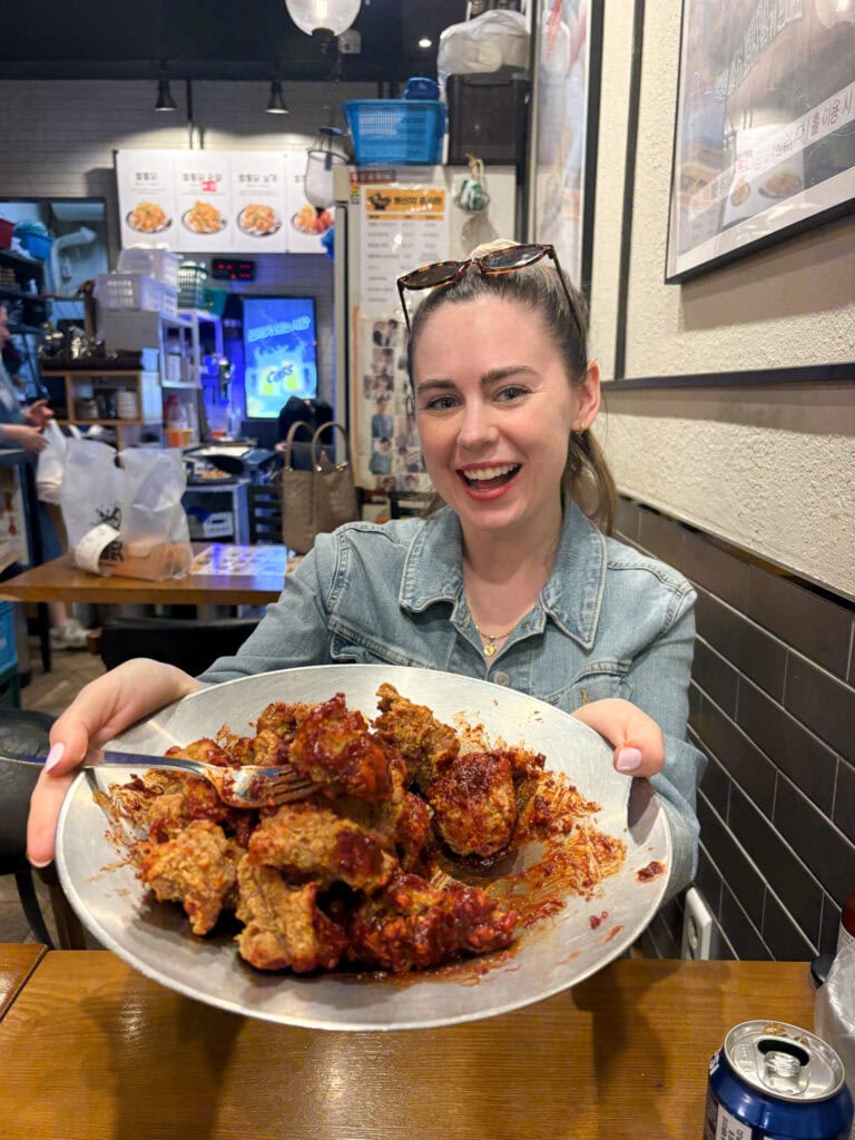 Sarah holding bowl of gluten free fried chicken