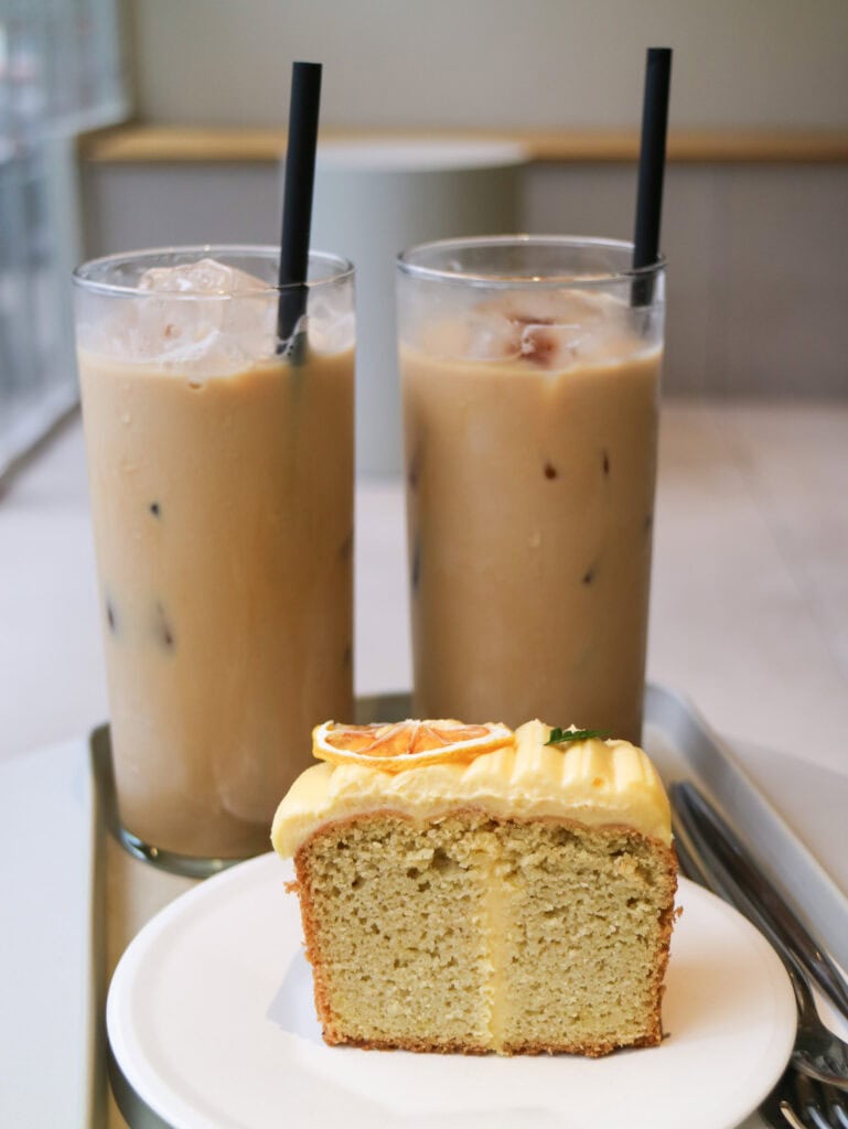 lemon cake with two coffees in background