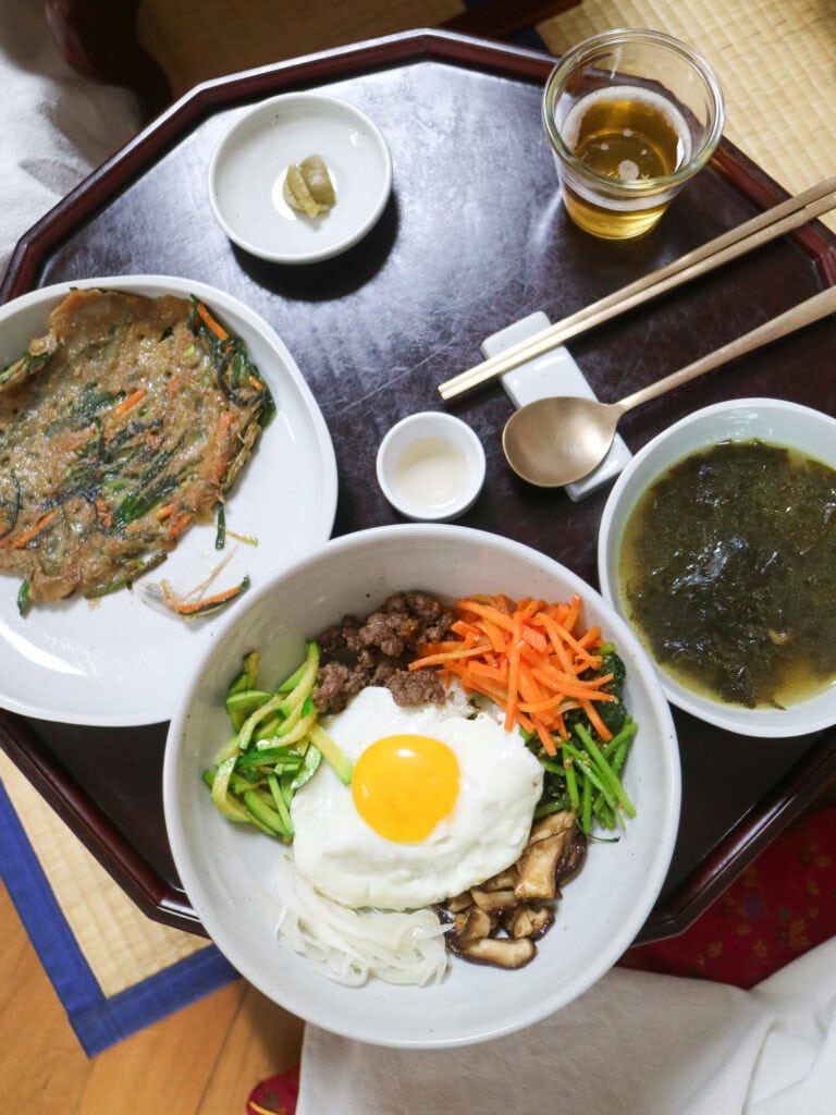 Traditional Korean gluten-free meal with rice, vegetables, and soup in Busan.