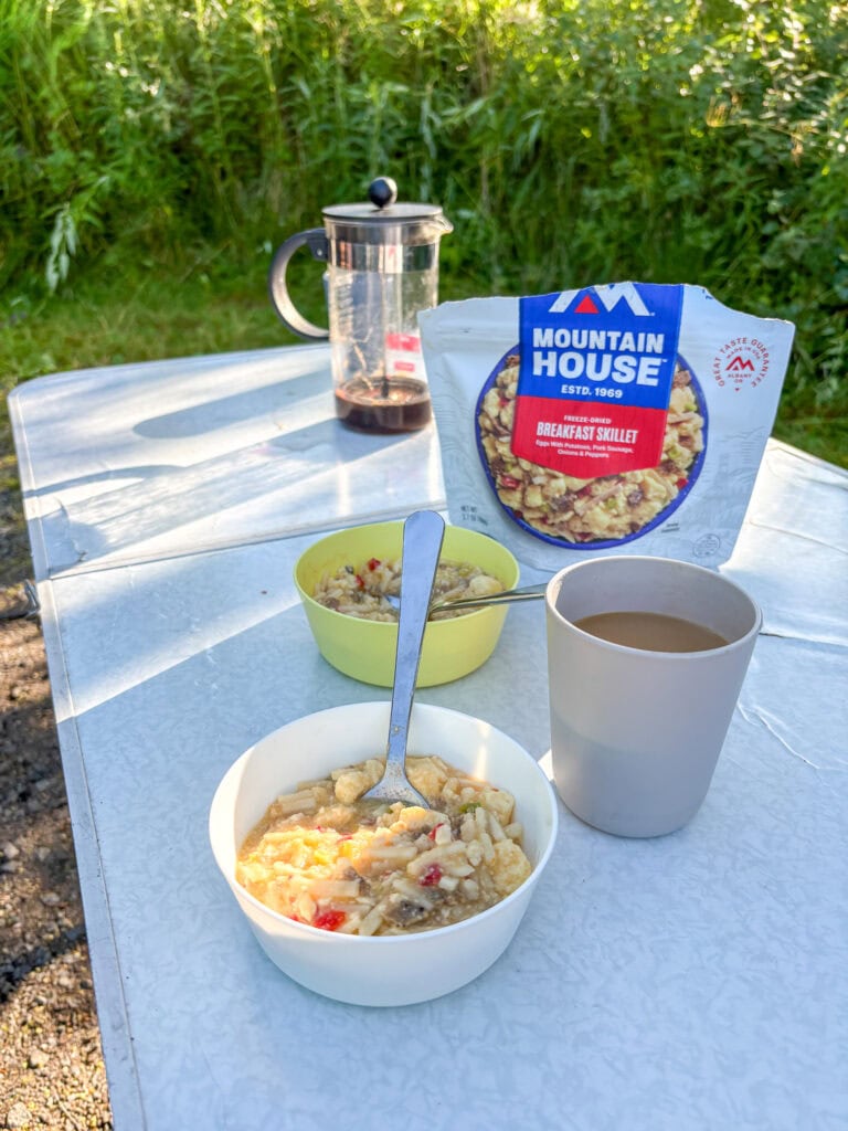 Gluten-free breakfast with oatmeal, coffee, and tea outdoors in Lofoten.