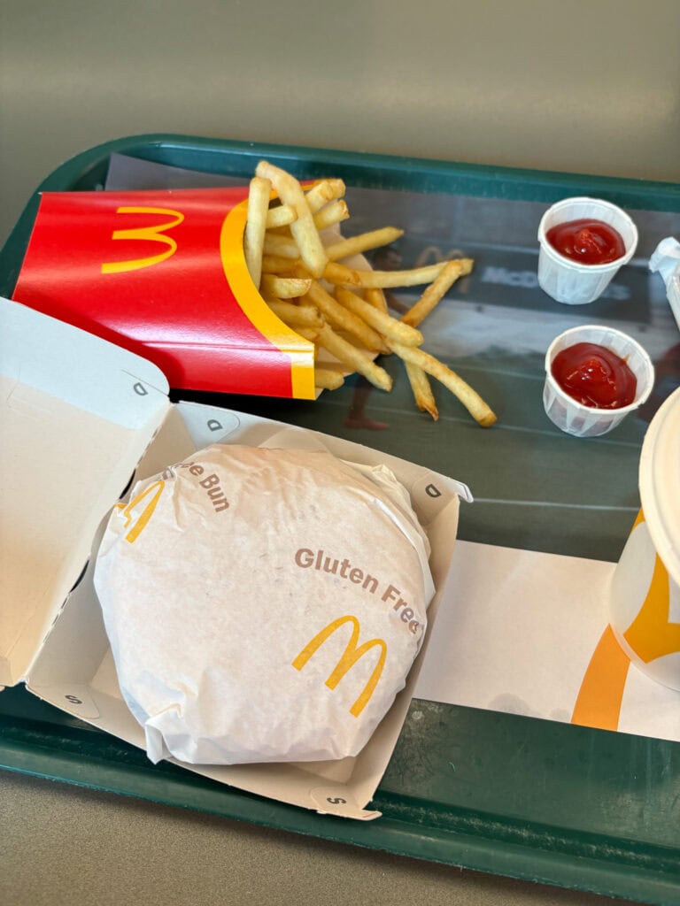 Gluten-free McDonald's meal with fries and ketchup on a tray.