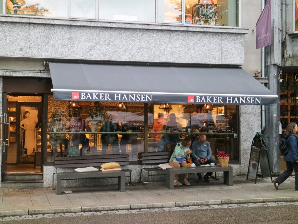 Baker Hansen bakery storefront with outdoor seating in Oslo, Norway.