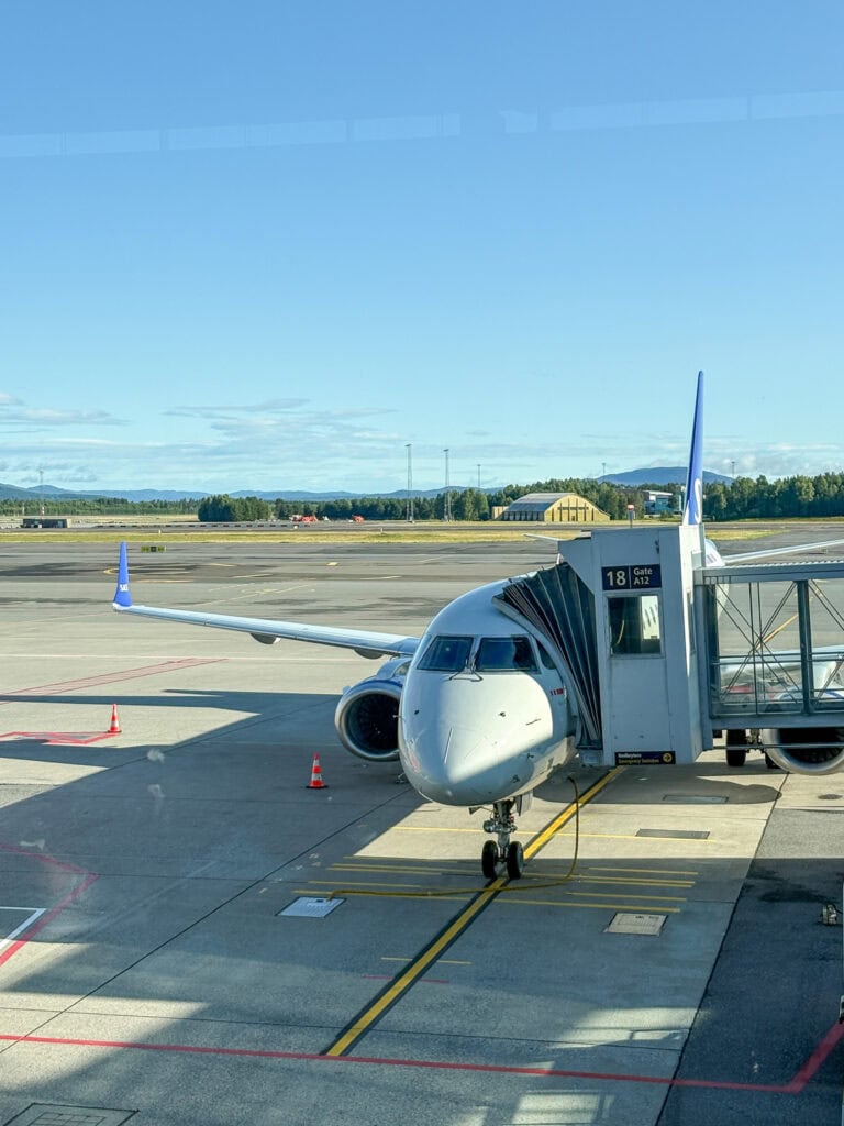 Passenger airplane at airport gate ready for boarding or departure.