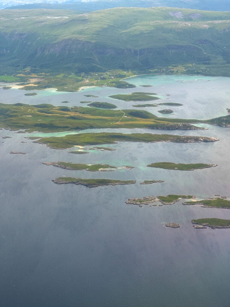 Aerial view of Lofoten islands with lakes and green mountains.