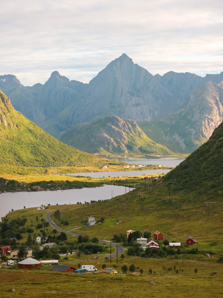 Scenic view of Lofoten mountains, fjords, and colorful village houses in Norway.