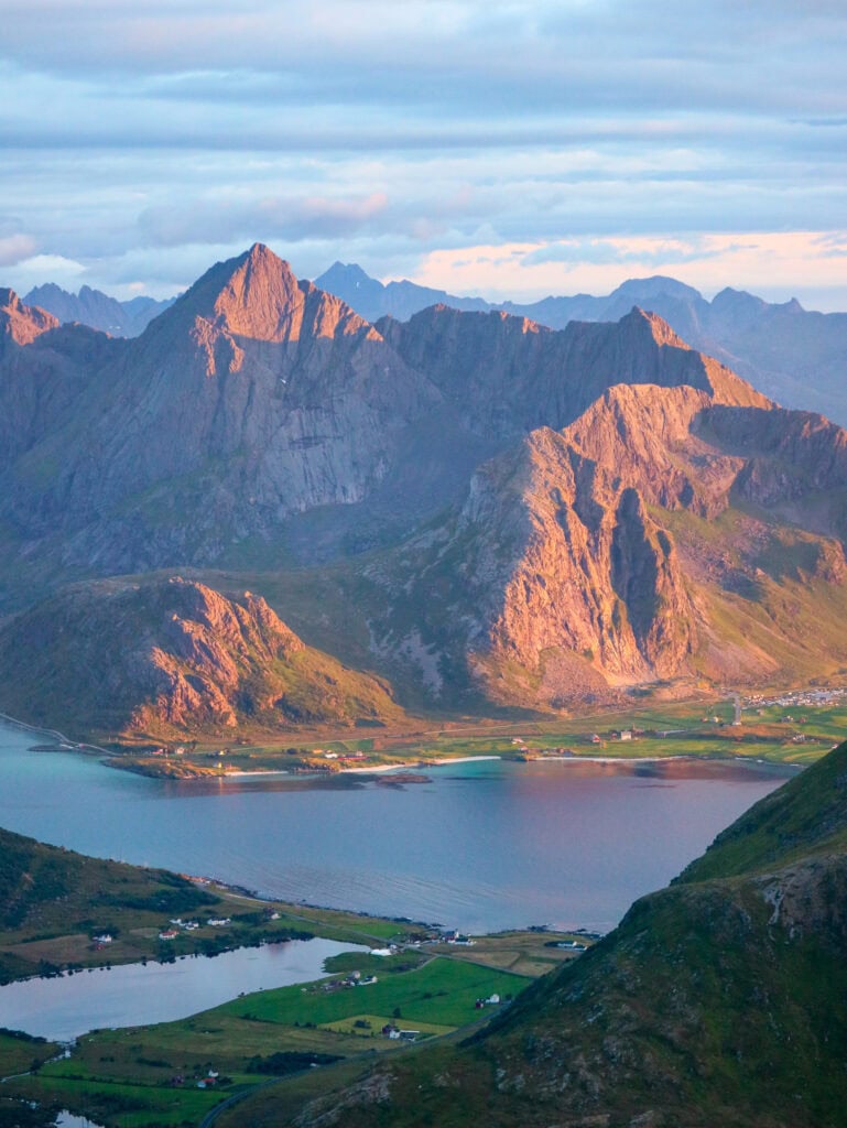Scenic view of Lofoten mountains and fjord at sunset.