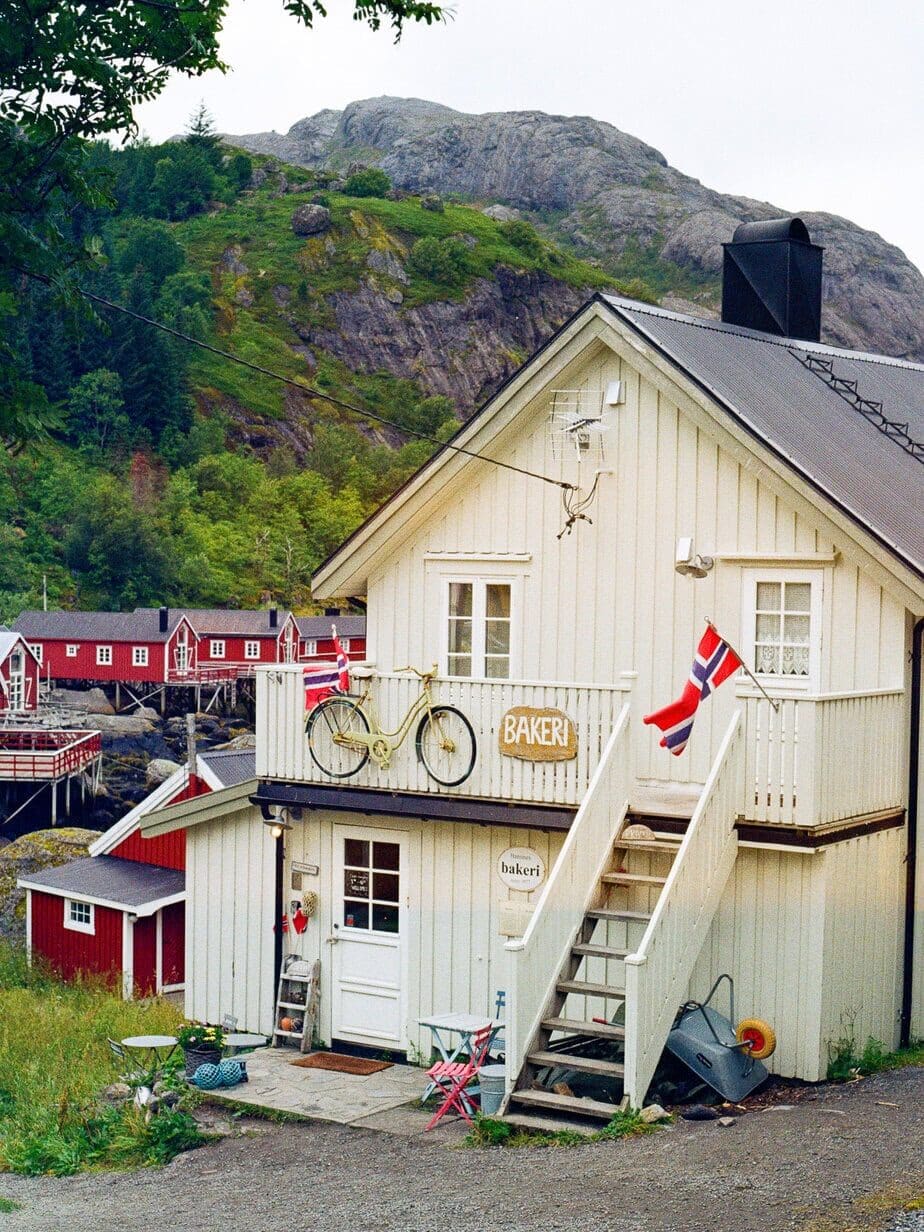 Charming Norwegian house with bicycle and flags in Lofoten, Norway.