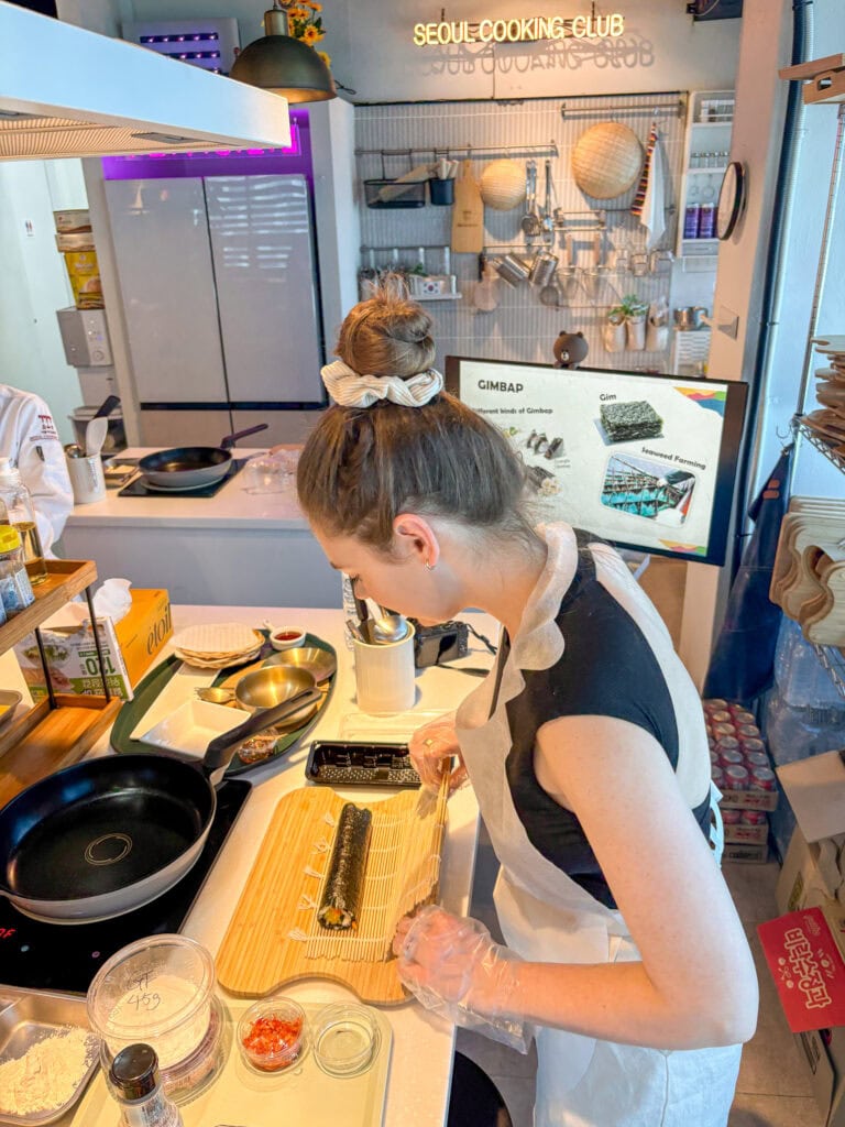 Woman preparing sushi at Seoul Cooking Club in Seoul, Korea.