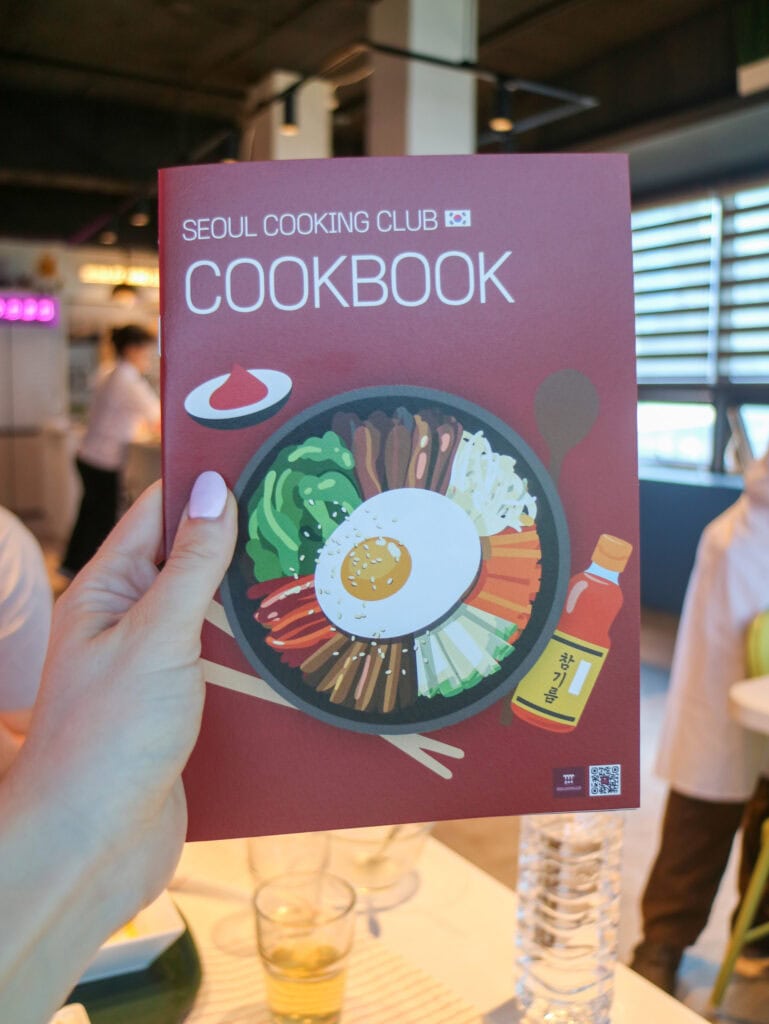 Seoul Cooking Club cookbook cover with Korean dishes and ingredients.